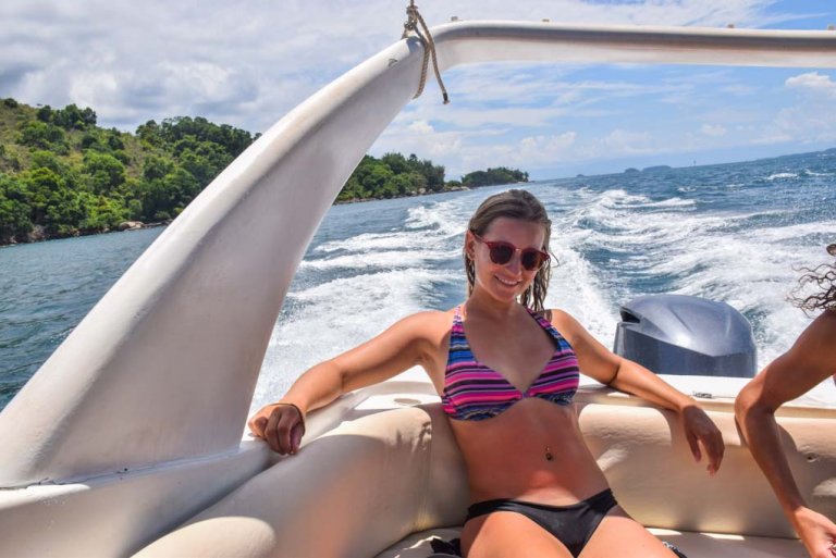 Bailey sits back on our boat tour around Ilha Grande, Brazil