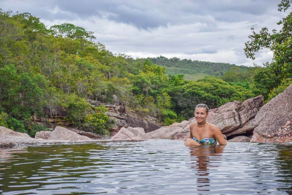 Bailey posses for a photo in a natural infinity pool at Ribeirão do Meio