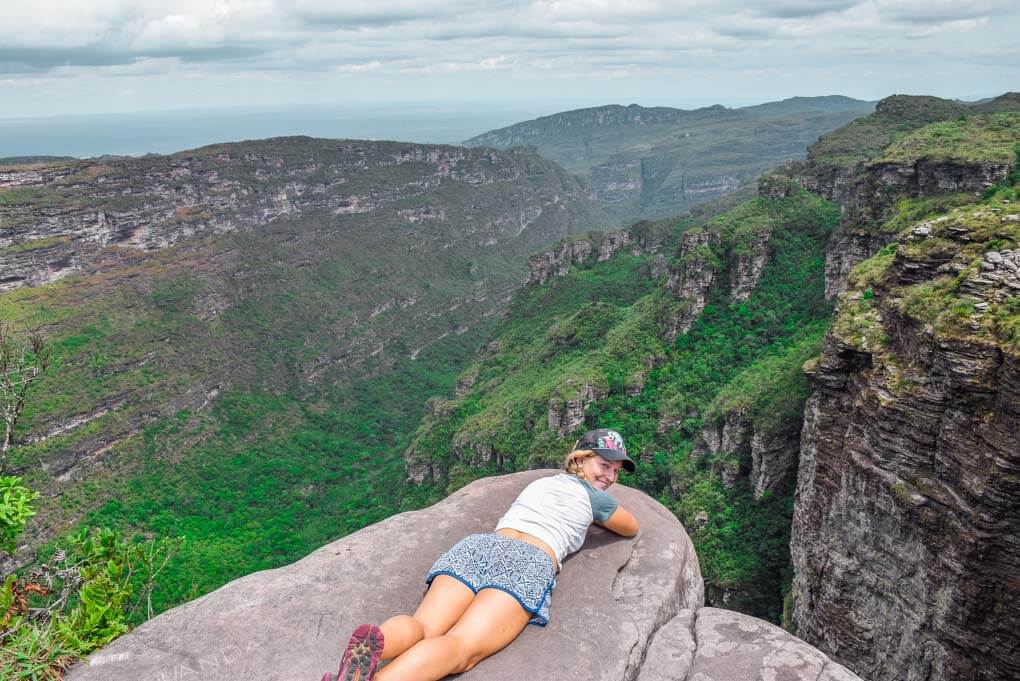 Bailey sits on the edge of the Cachoeira da Fumaça waterfall in Chapada Diamantina National Park