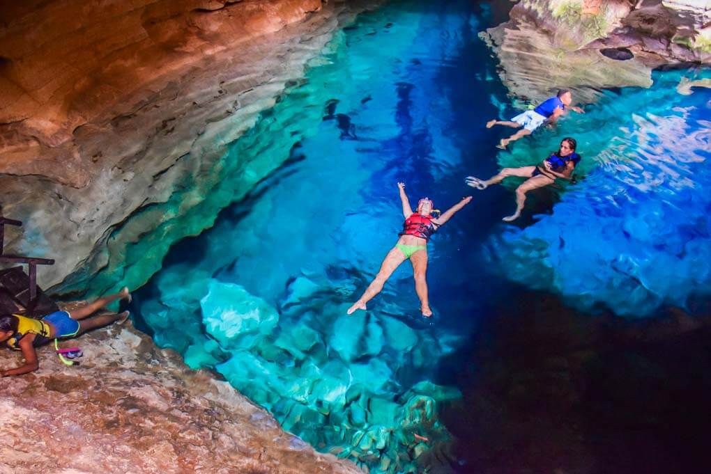 Bailey swims in Poco Azul in Chapada Diamantina National Park in Brazil