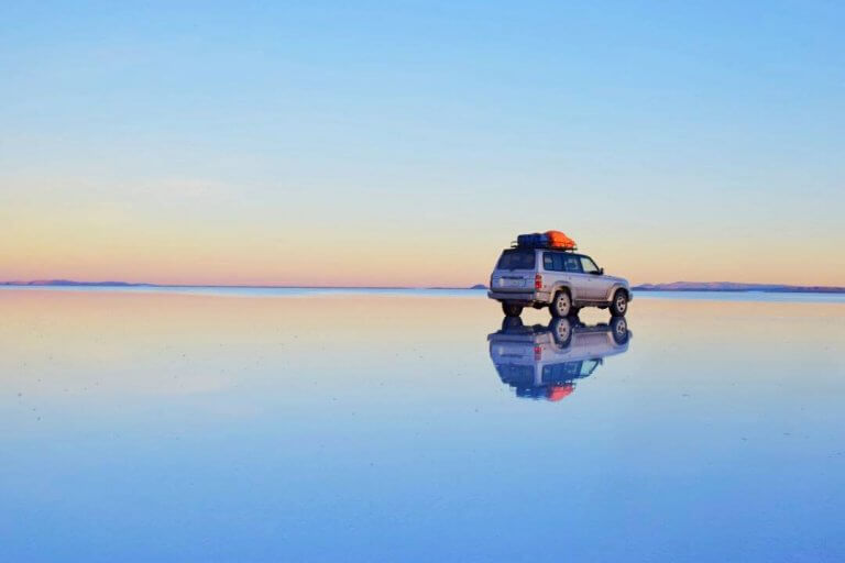 car on the salt flats in bolivia