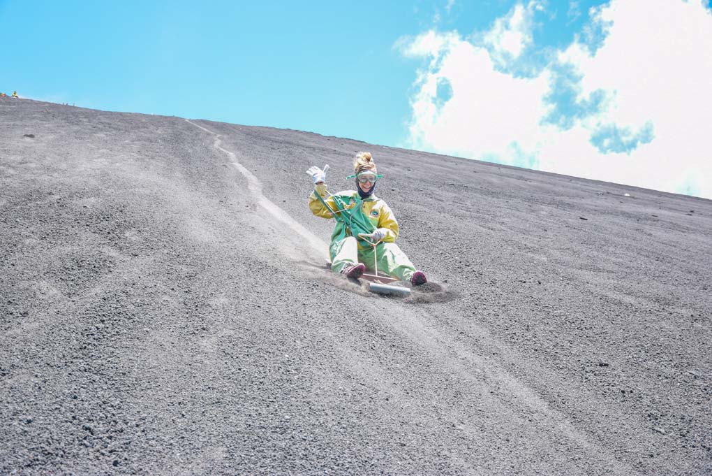 Bailey sliding down the Cerro Negro Volcano during the famous volcano boarding tour near Leon, Nicargua