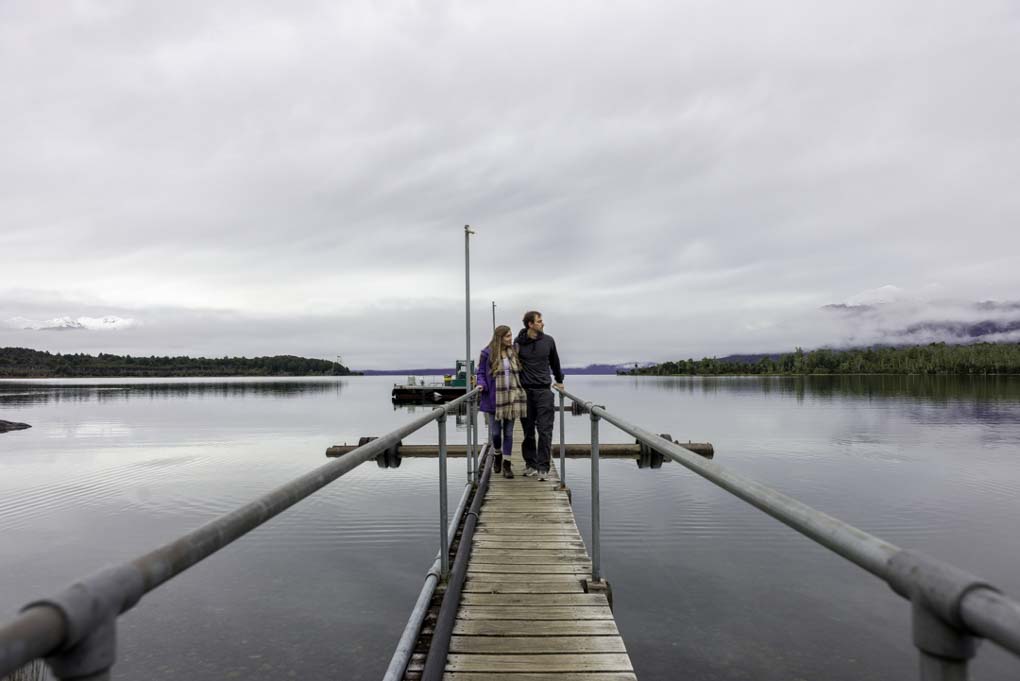 Bailey and I walk along the jetty in Te Anau Downs, New Zealand