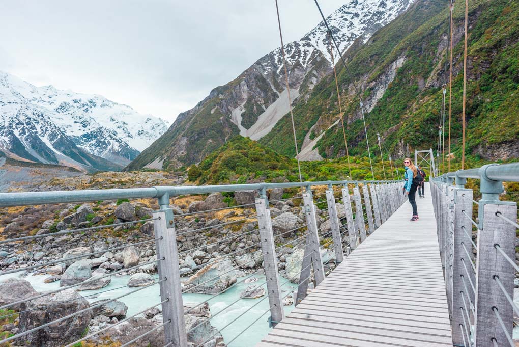Bailey on a suspension bridge on the Hooker Valley Track looking out over the Hooker River
