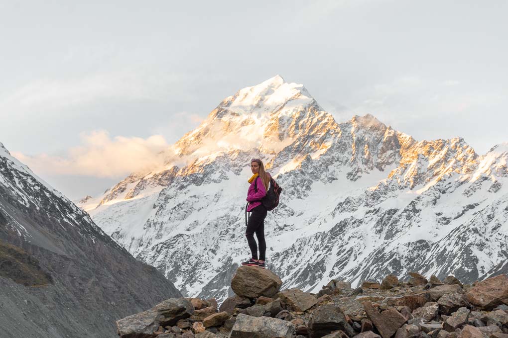 Baiely standing in the shodow of Mount Cook on the Hooker Valley Trail