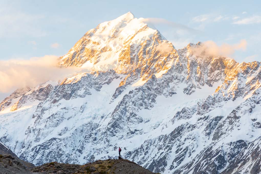 Bailey standing in the shodow of Mount Cook on the Hooker Valley Track