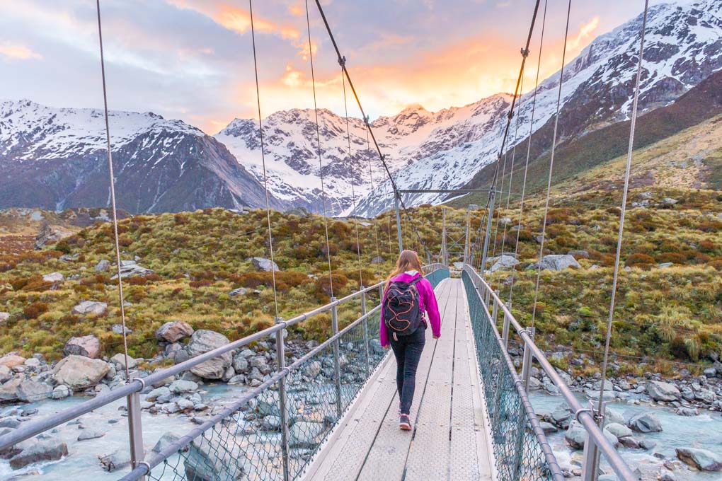 Bailey walking on one of the suspension bridges on the Hooker Valley Track in Mount Cook National Park, New Zealand