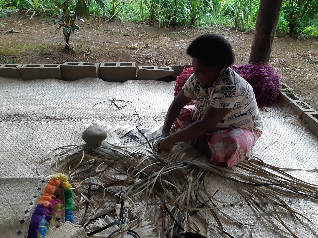 a weaving demonstration at the Fiji Culture Village