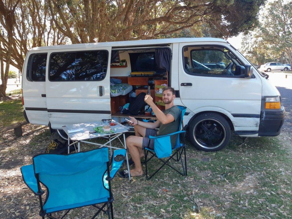 having a drink outside our campervan