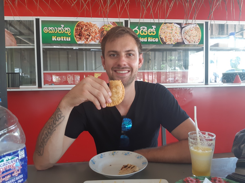 Daniel eating roti in Dambulla, Sri Lanka
