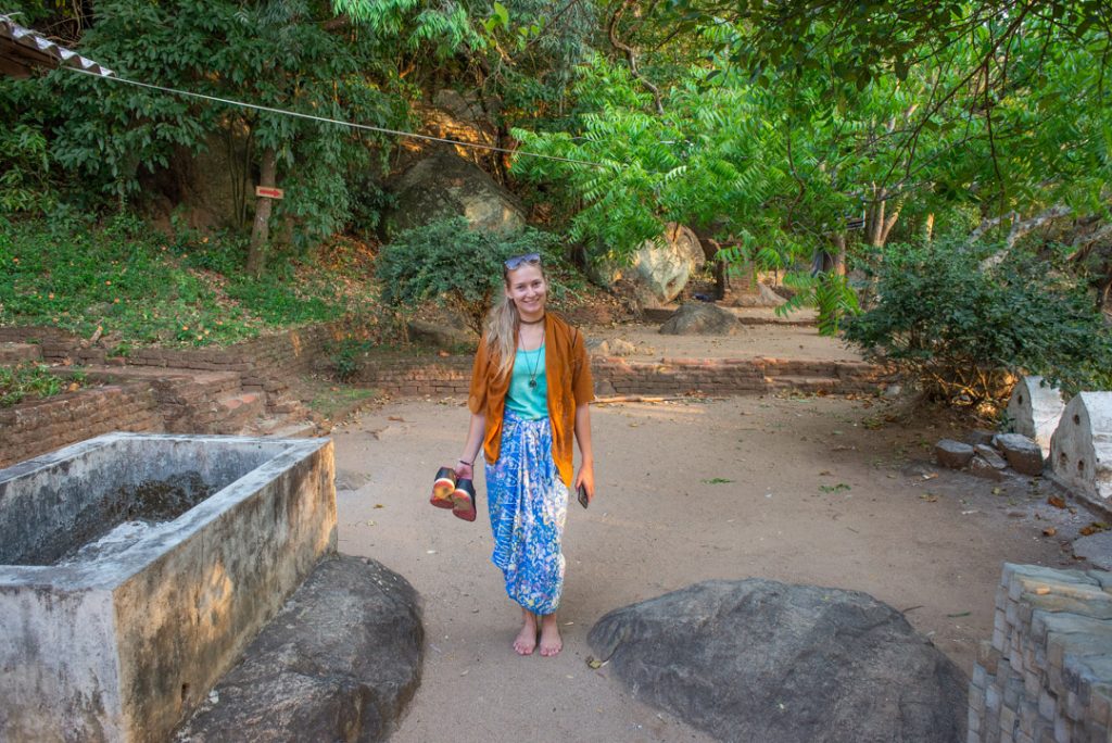 Showing the dress requirements at Pidurangala temple 