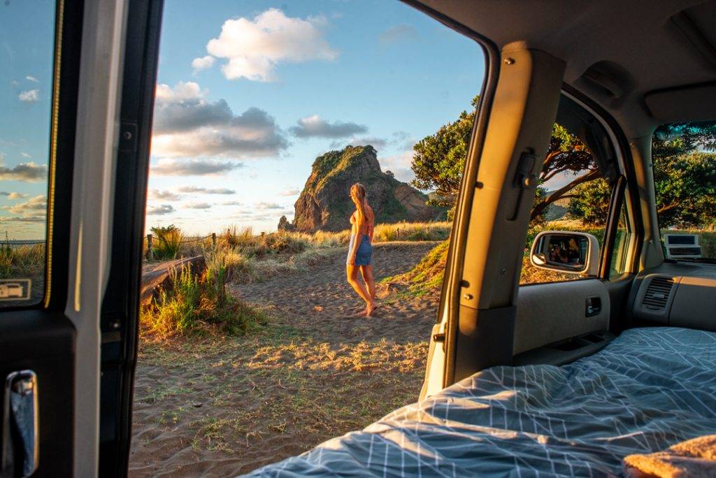view of the beach from inside a campervan