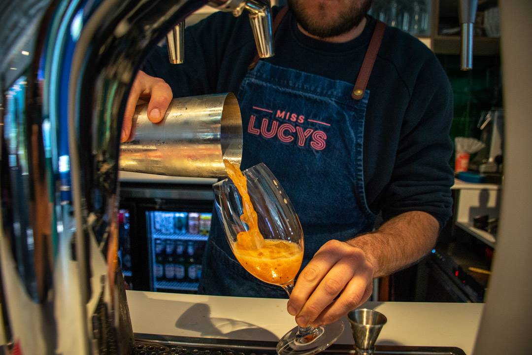 bartender making cocktails at Miss Lucy's bar in Queenstown, New Zealand
