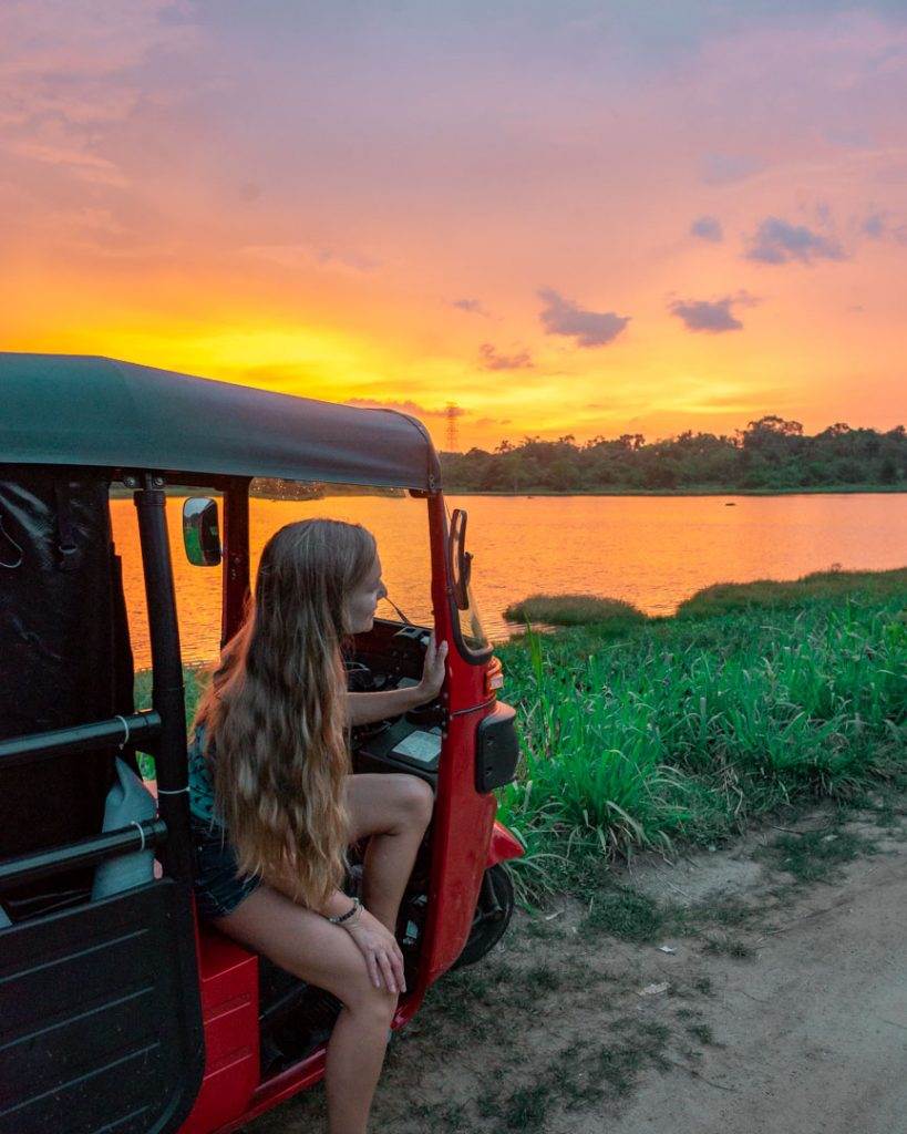 Watching sunsets in Sri Lanka from our tuk tuk