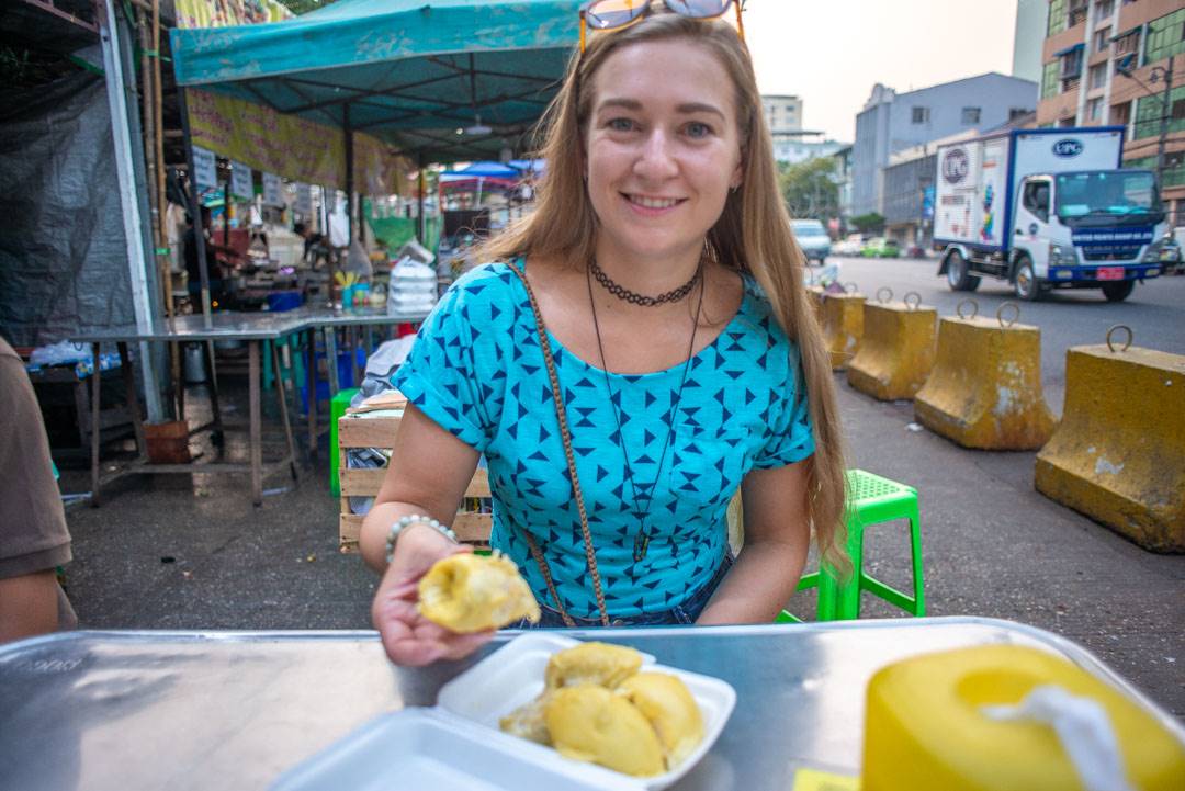 trying durian on a food tour in myanmar