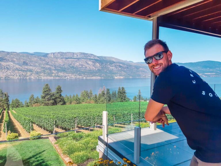 Daniel leans on the railing at the Arrowleaf Winery in Lake Country near Vernon, BC