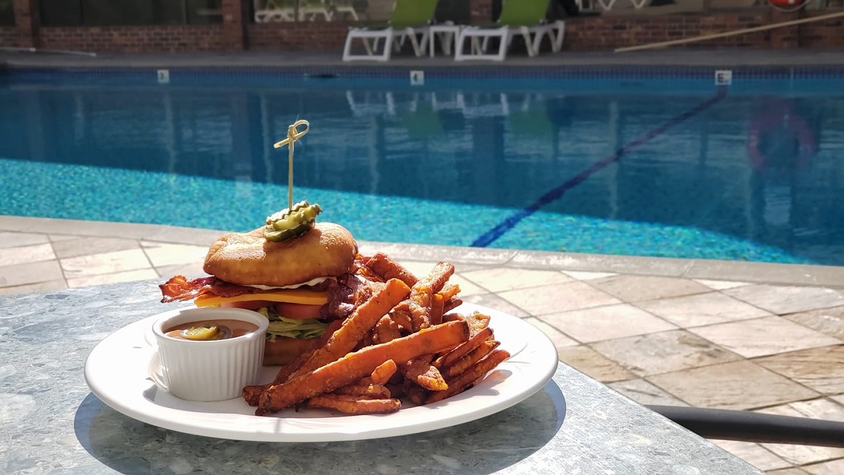 burger meal at the pool at the Coast Capri Hotel in Kelowna