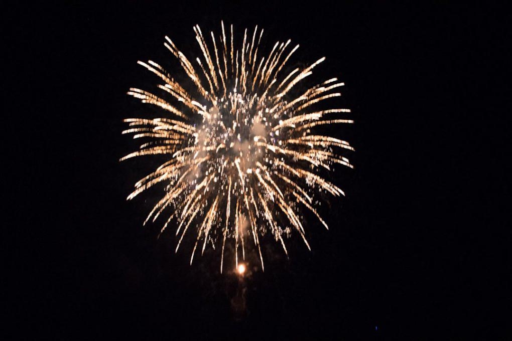 A firework explodes in the air