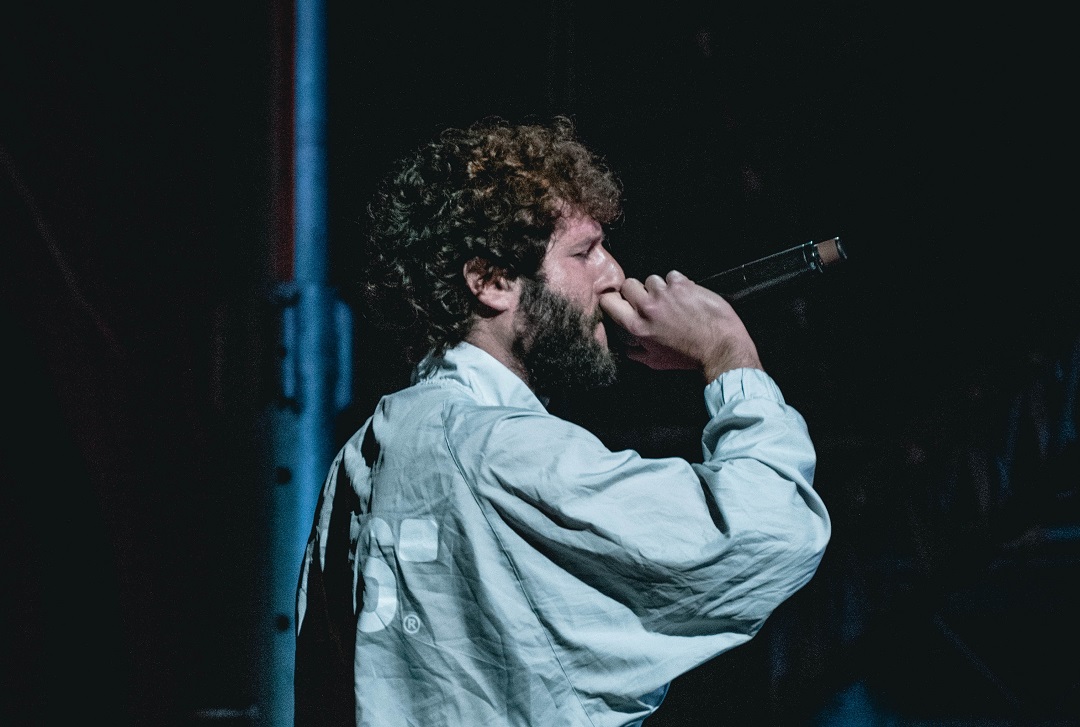 A comedian tells a joke at a show in Saskatoon, Canada
