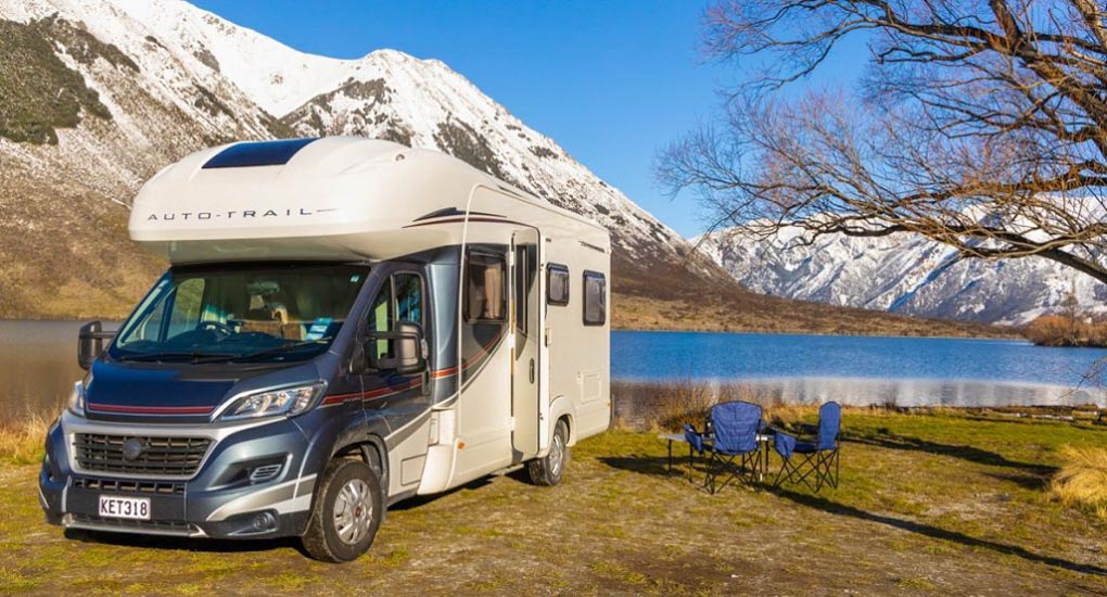 A New Zealand motorhome sits by a lake in New Zealand