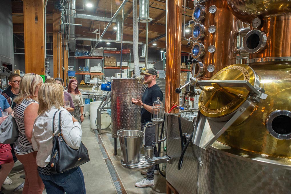 A worker at the Lucky Bastard Distillery in Saskatoon explains to our group the distillery process