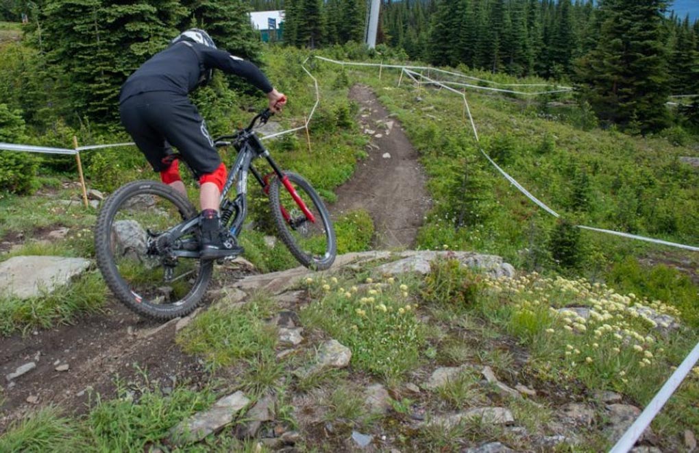 A man rides his mountain bike in a bike park