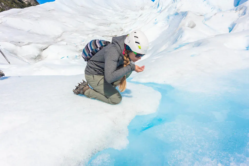 drinking glacier water from perito moreno glacier