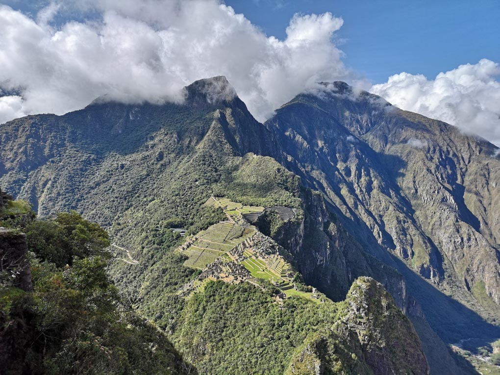 A photo of Machu Pichu, Huayna Picchu and Machu Picchu Mountain from Across the valley. 