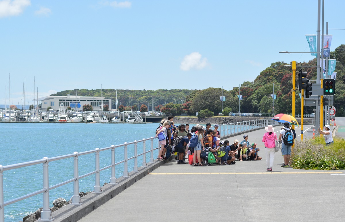 group of tourists on the street in Auckland, New Zealand