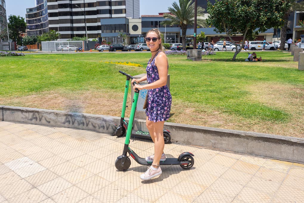 Bailey rides a scooter along the Malecon in Miraflores