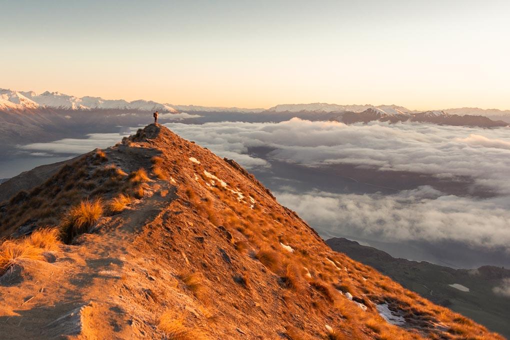 Standing on the famous Roy's Peak viewpoint at sunrise