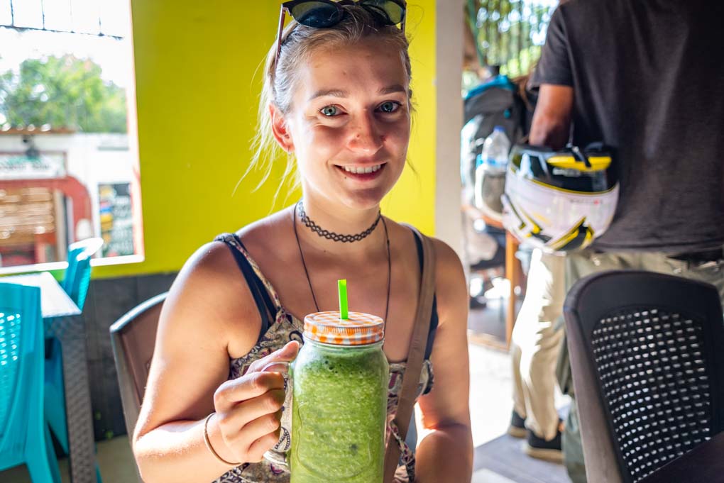 Bailey enjoying a fresh juice from Smoothies Restaurant in Minca, Colombia