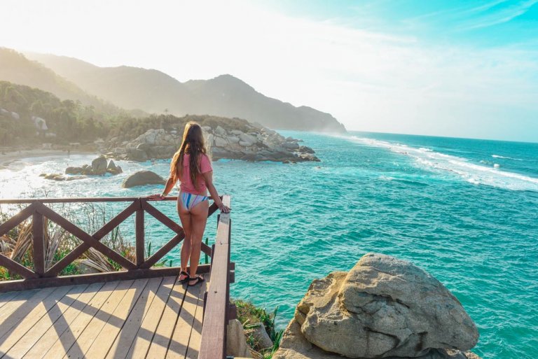 Bailey stands on the viewpoint at Caba San Juan in Tayrona National Park, Colombia