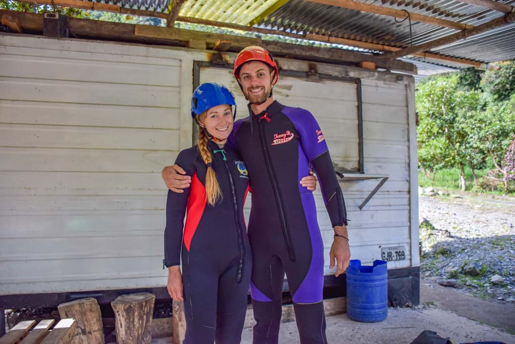Bailey and Daniel pose for a photo in Banos, Ecuador before going canyoning
