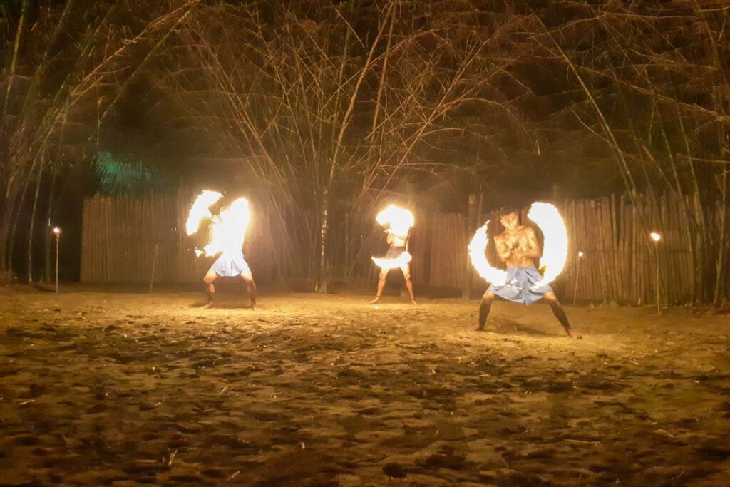 three fire dancers at the Fiji Culture Village in Nadi, Fiji
