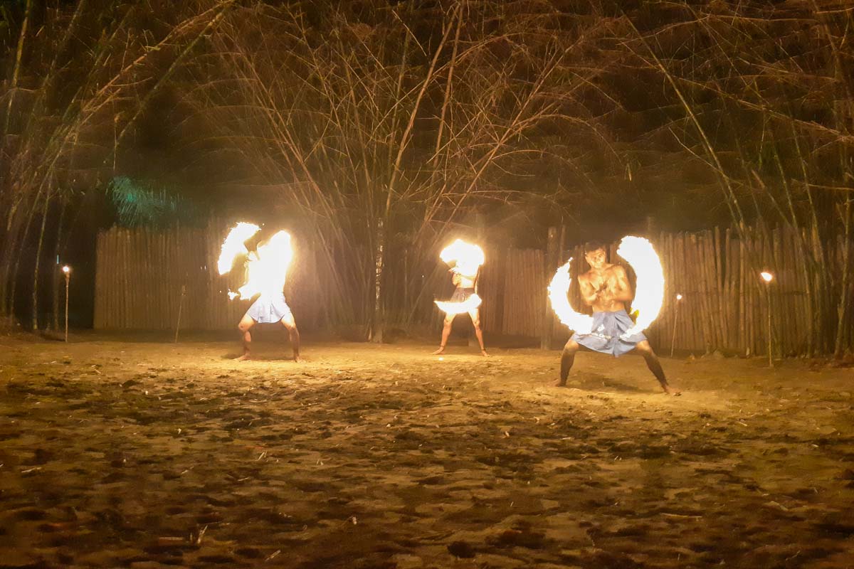 three fire dancers at the Fiji Culture Village in Nadi, Fiji