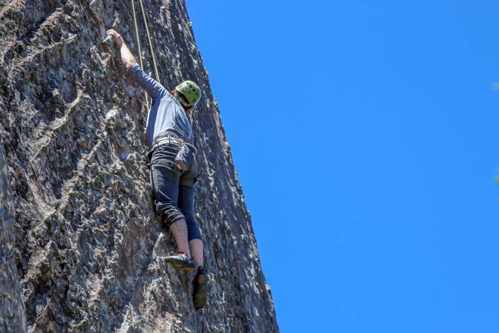 A man rock climbs