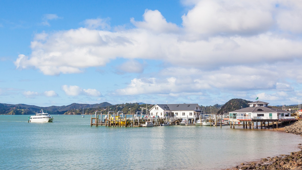 view of the warf and waterfront shops in Paihia, New Zealand