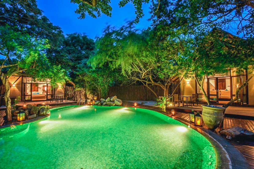 The pool and deluxe rooms at the ungle Beach by Uga Escapes