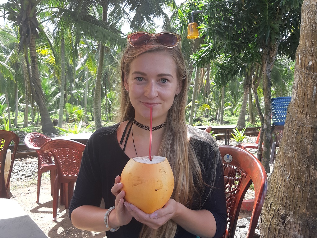drinking fresh coconut water in Hikkaduwa, Sri Lanka