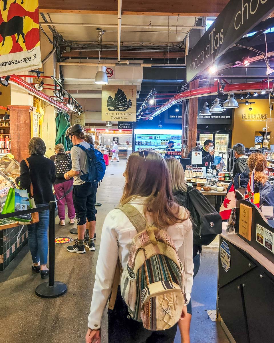 Bailey wonders the Granville Island Market in Vancouver, BC