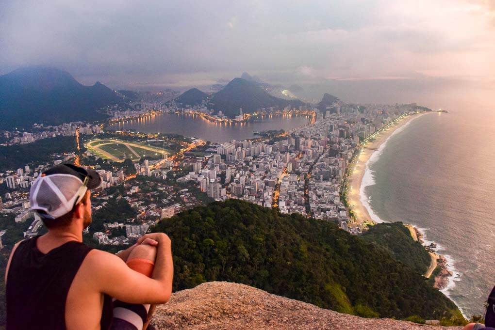 Daniel sits at the top of the Two Brother hike aka Morro Dois Irmãos overlooking Rio de Janeiro, Brazil