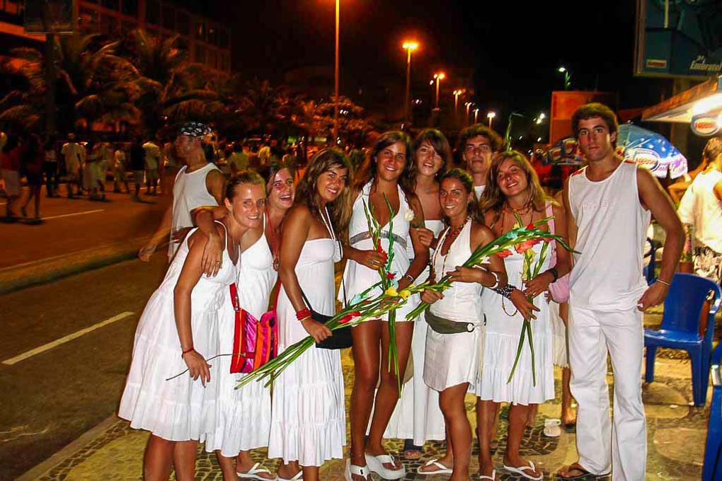 A group of poeple dressed in white get ready to celebrate the New year in Rio de Janeiro, Brazil