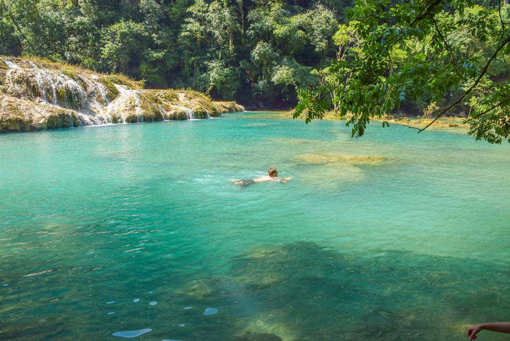 Daniel swims in a small pool at Semuc Champey, Guatamala
