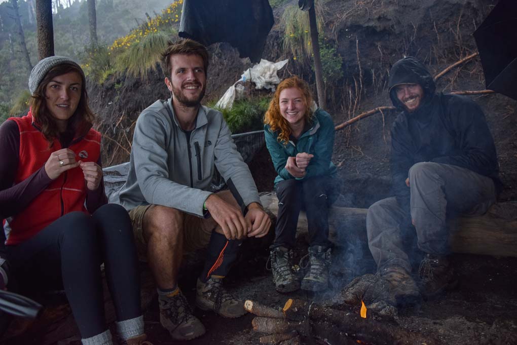 sitting around the fire at base camp on the Acatenango Volcano, Guatemala
