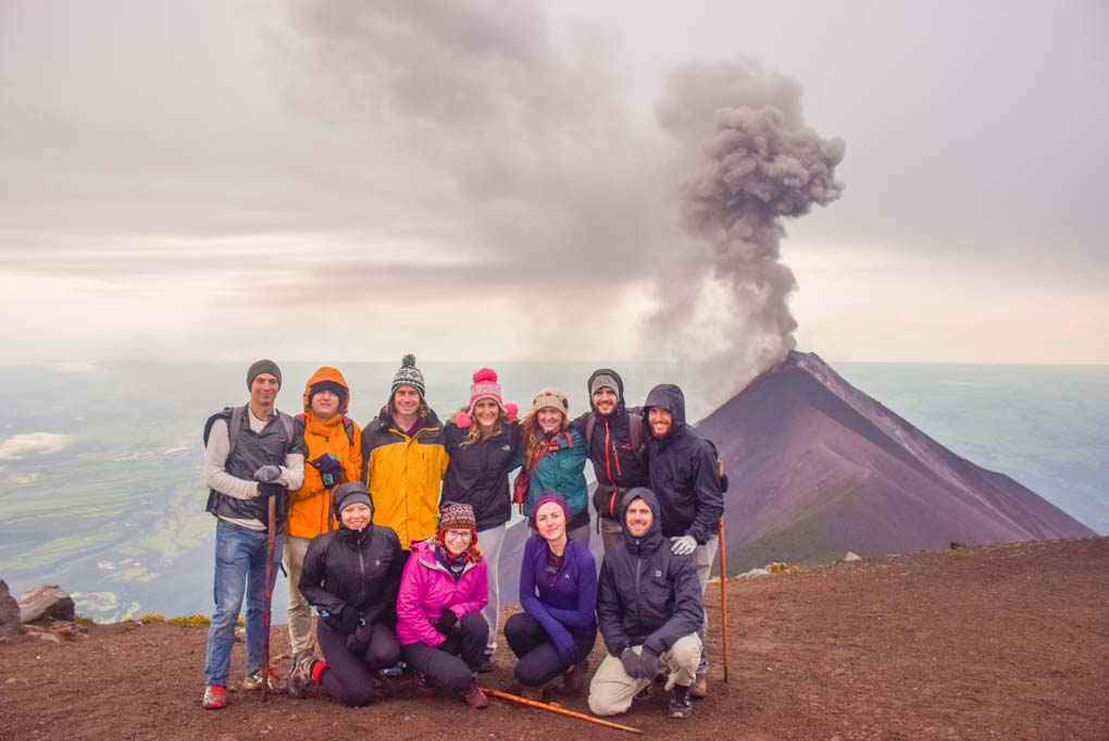 tour group photo after hiking to the top of Acatenango Volcano for sunrise