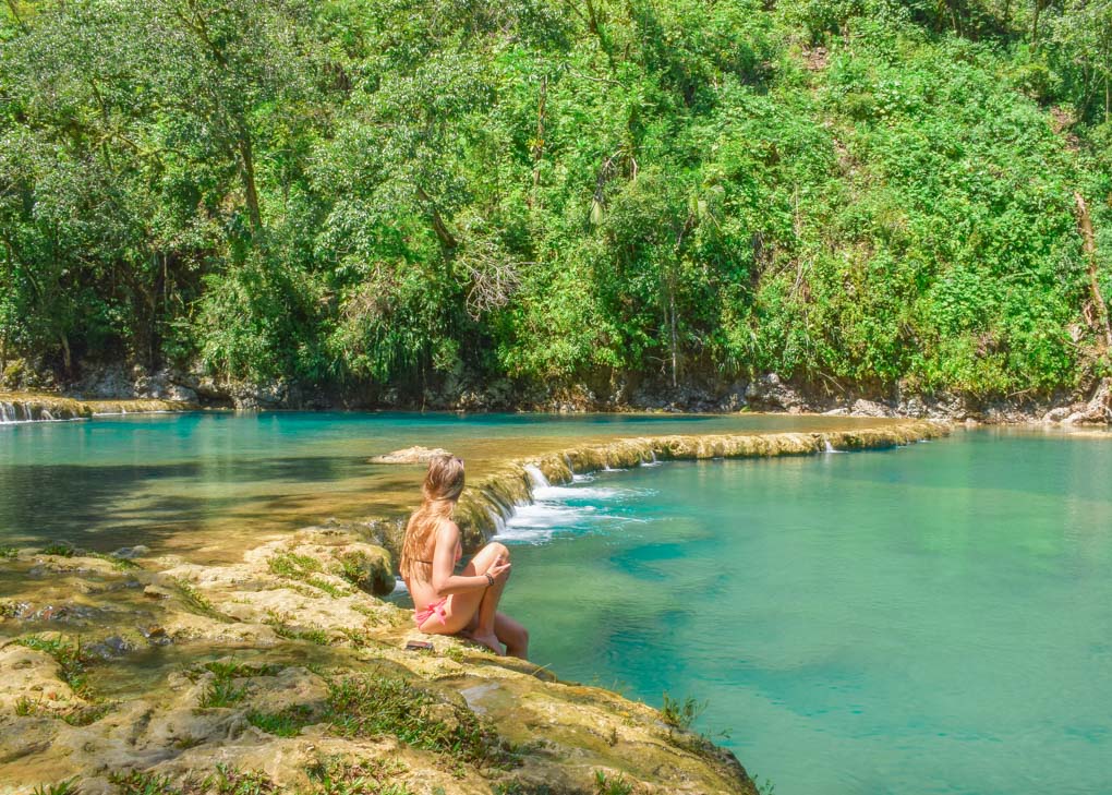 Bailey sits on the edge of one of the pools at Semuc Champey