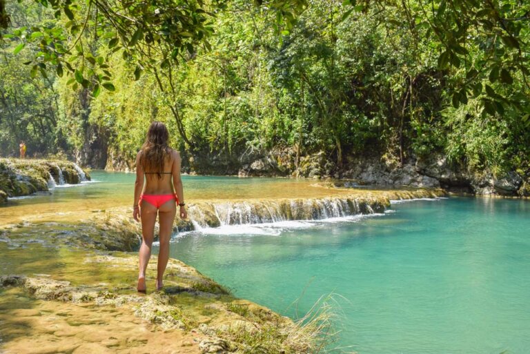 Bailey walks along the edge of one of the pools at Semuc Champey in Guatemalal