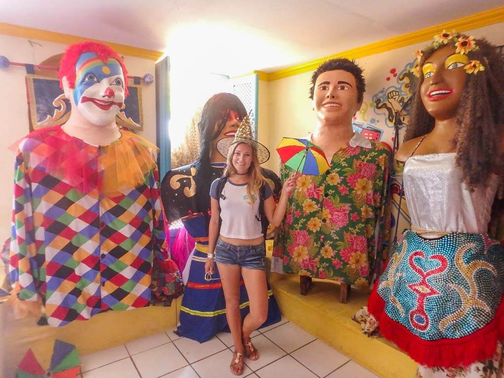 Bailey posing with carnival decorations in Olinda, Brazil