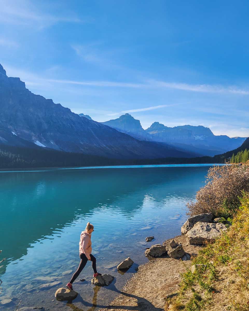 Bailey steps onto a rock at Waterfowl Lakes on the Icefields Parkway